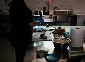 a woman in Georgia works in the kitchen